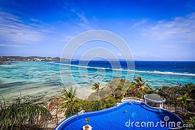 Overlook of a Infinity pool on a tropically island Stock Photo